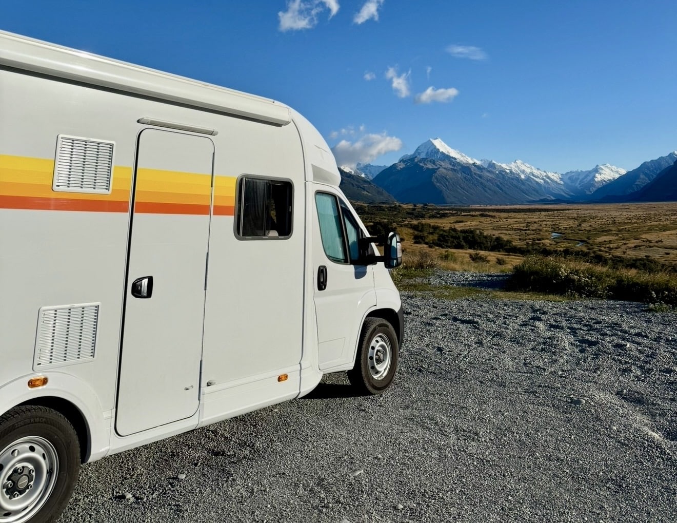 Campervan in shadow of Mount Cook in New Zealand