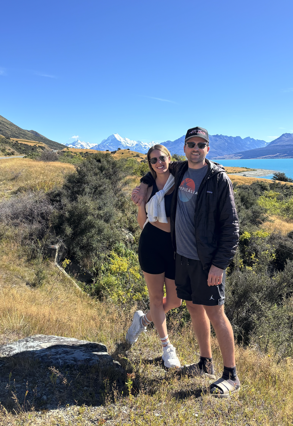 Lightweight outfit for summer adventure travel in New Zealand including sports bra and hiking shorts