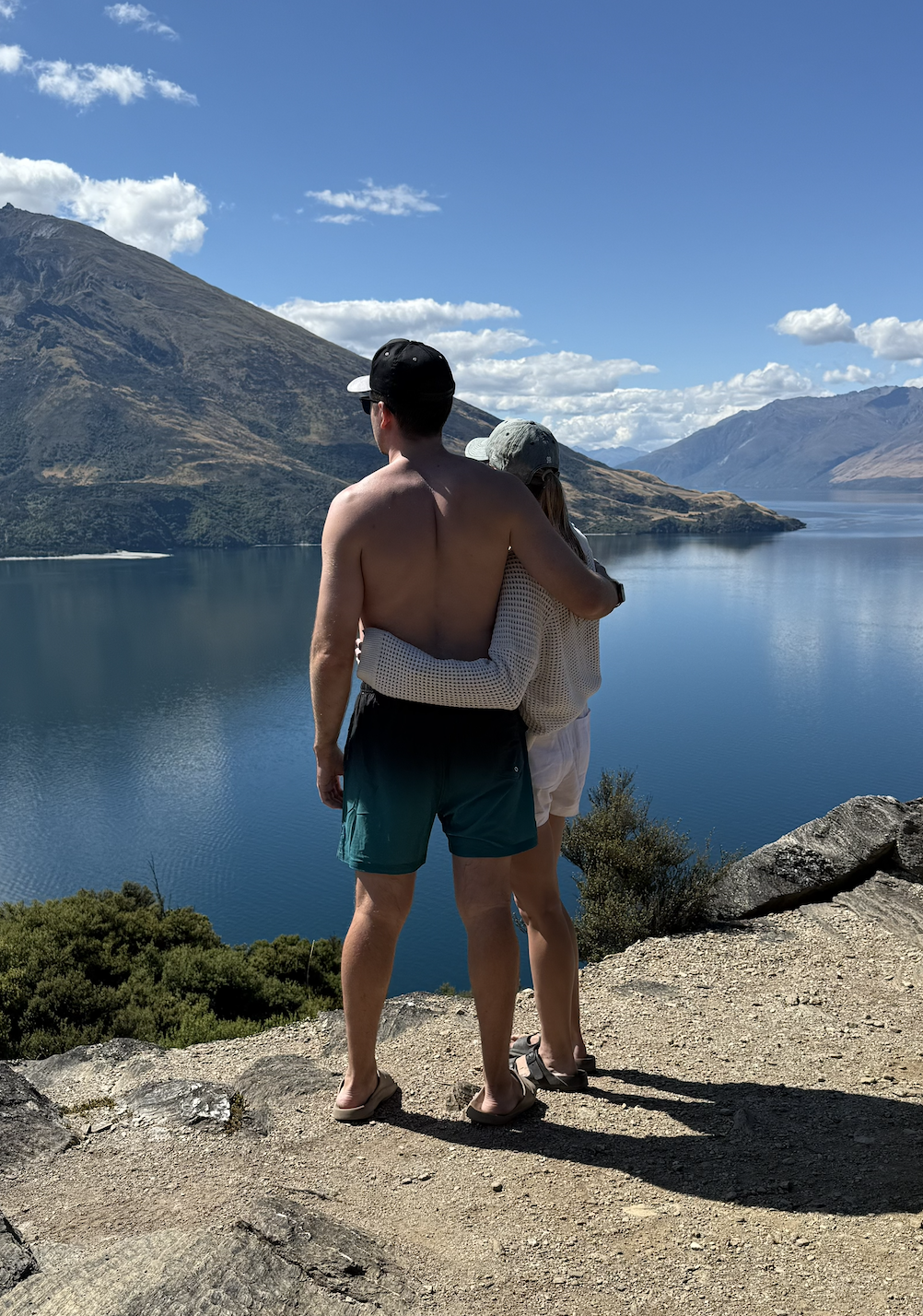 couple embracing at mou waho island by the arethusa pool in wanaka new zealand