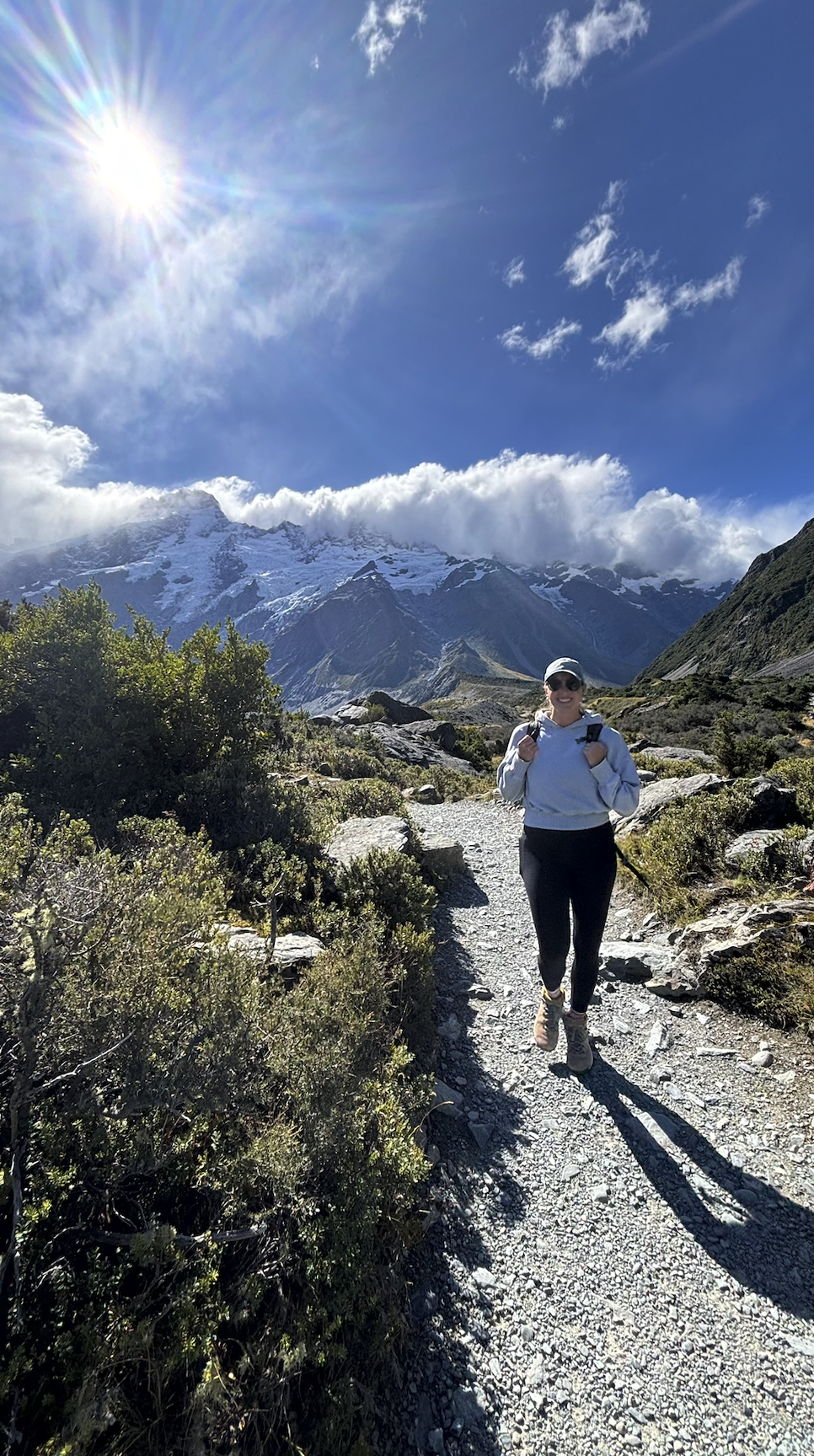 Woman hiking solo Hooker Valley Track New Zealand