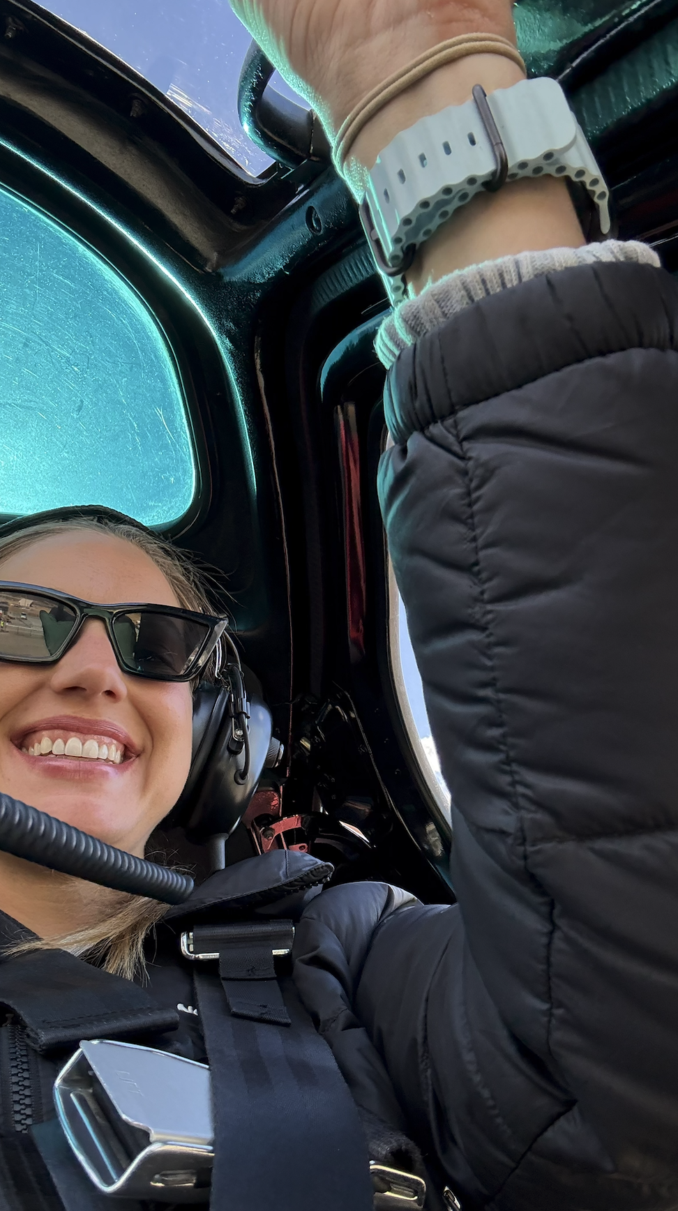 Woman in helicopter to heli hike tasman glacier New Zealand