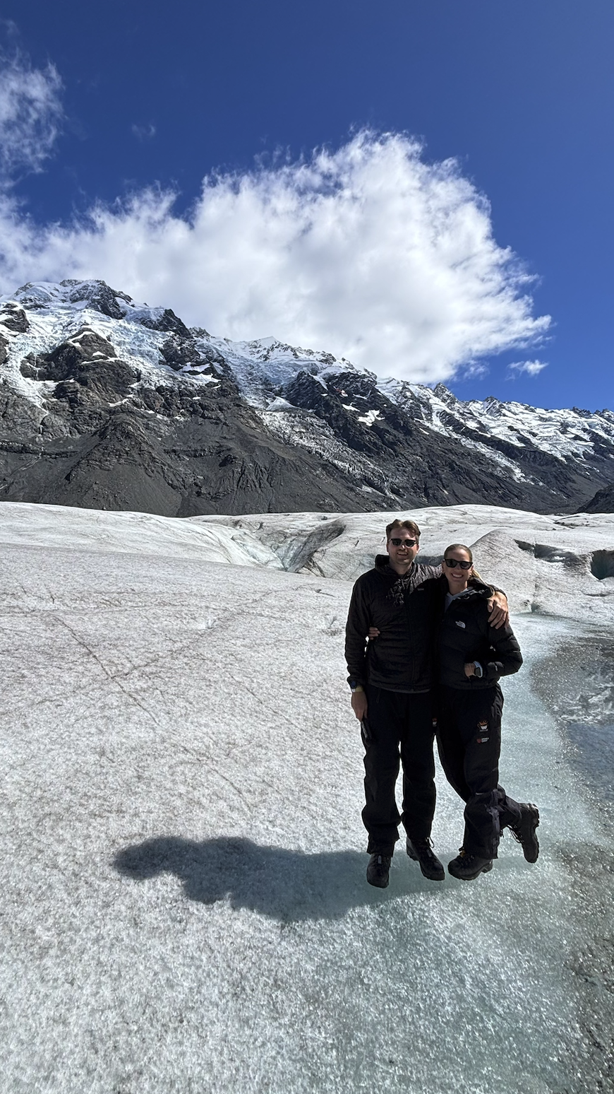 Couple doing heli hike tasman glacier New Zealand
