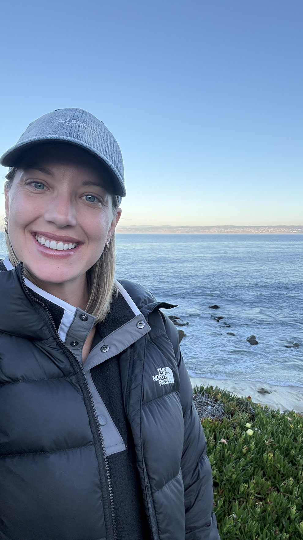 woman on road trip of pacific coast highway in California in front of the ocean